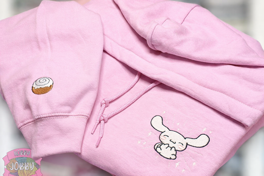 Flying Dog Friend Embroidered Hoodie with Cinnamon Roll Sleeve Embellishment